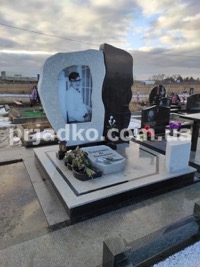Фото индивидуального памятника на заказ из белого гранита.